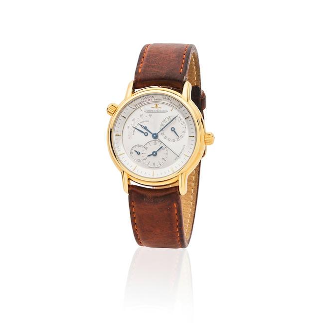 Jaeger-LeCoultre. An 18K gold automatic calendar dual time wristwatch with power reserve indication Jaeger-LeCoultre. Montre bracelet en or jaune 18K (750) avec date, second fuseau horaire et indication de réserve de marche mouvement automatique Géographique, Ref: 169.1.92, Circa 1990
