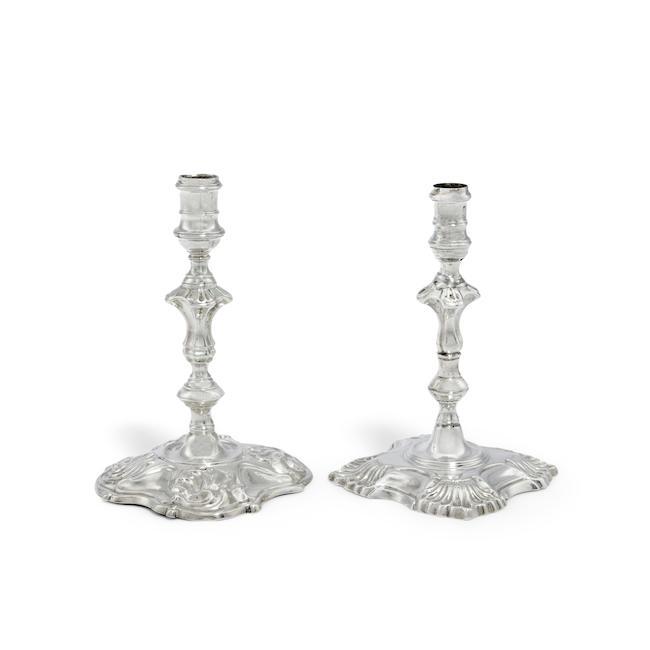 A George II cast silver taperstick Elizabeth Oldfield, London 1752 together with another George II cast taperstick, possibly James Gould, London 1745 (2)